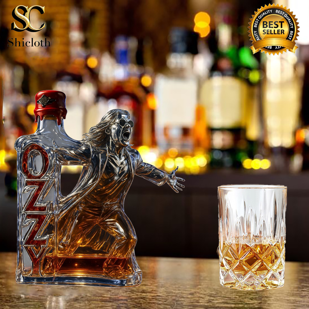 This version of the sculpted Ozzy bottle features a bright red wax-dripped cap, referencing Maker’s Mark. Ozzy’s screaming figure is boldly carved, and the red-glass OZZY letters shine with depth. The background glows with warm bar lights, enhancing the collectible’s rock-and-roll presence! 