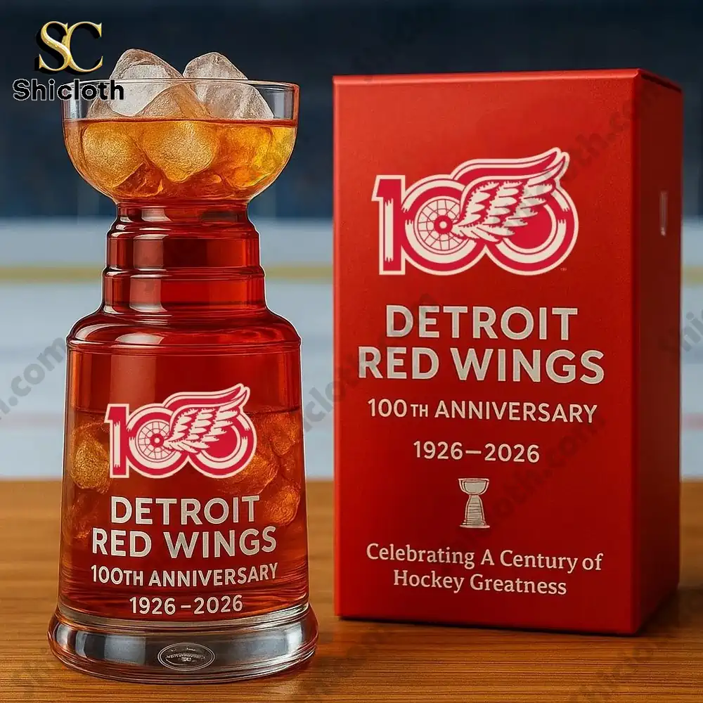 Red anniversary whiskey glass with winged wheel logo by Shicloth