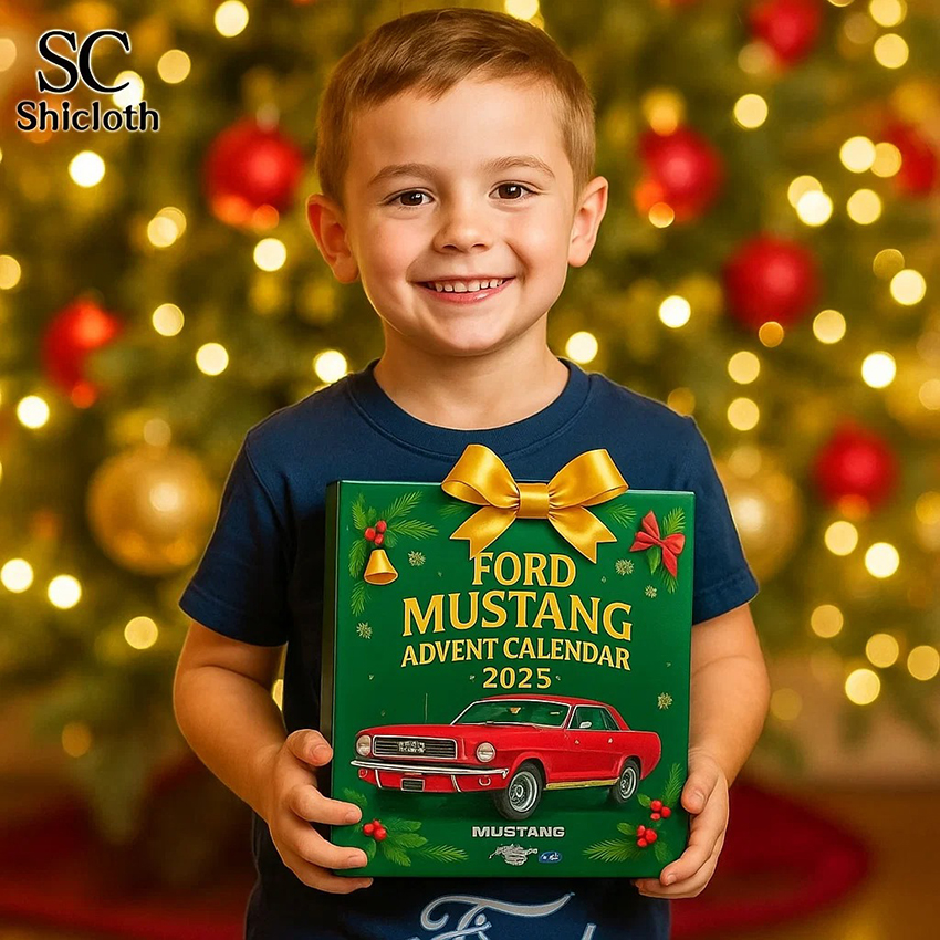 A young boy holding a Ford Mustang Advent Calendar 2025 with a red Mustang car design in front of a Christmas tree.