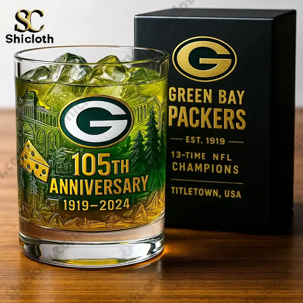 A whiskey glass with the Green Bay Packers logo and 105th anniversary design.