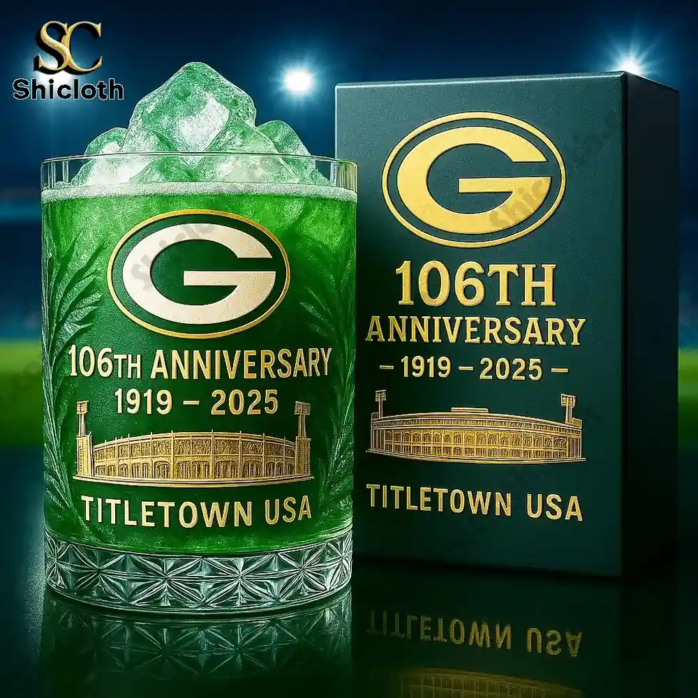 A whiskey glass with the Green Bay Packers logo and 106th anniversary design.