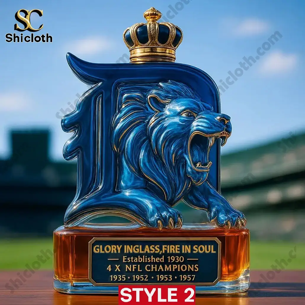 A blue Detroit Lions whiskey bottle with a golden crown cap and engraved 4x NFL championship years!