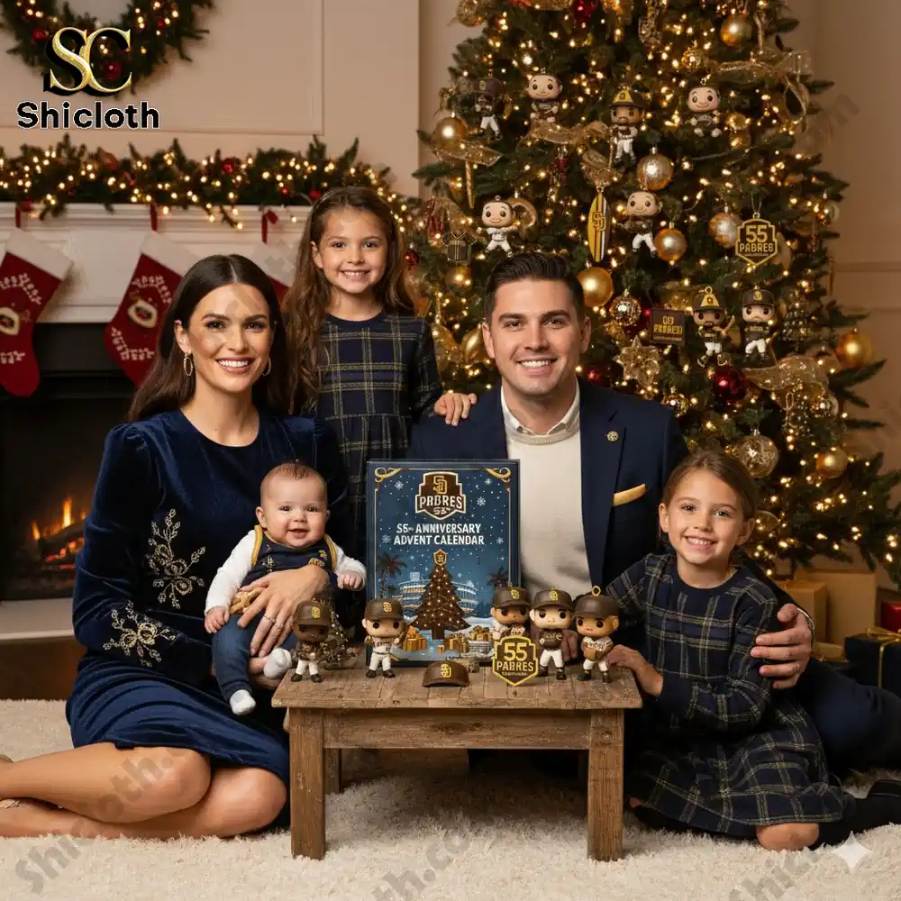 Family sitting by a Christmas tree with a Padres 55th Anniversary Advent Calendar and collectibles.