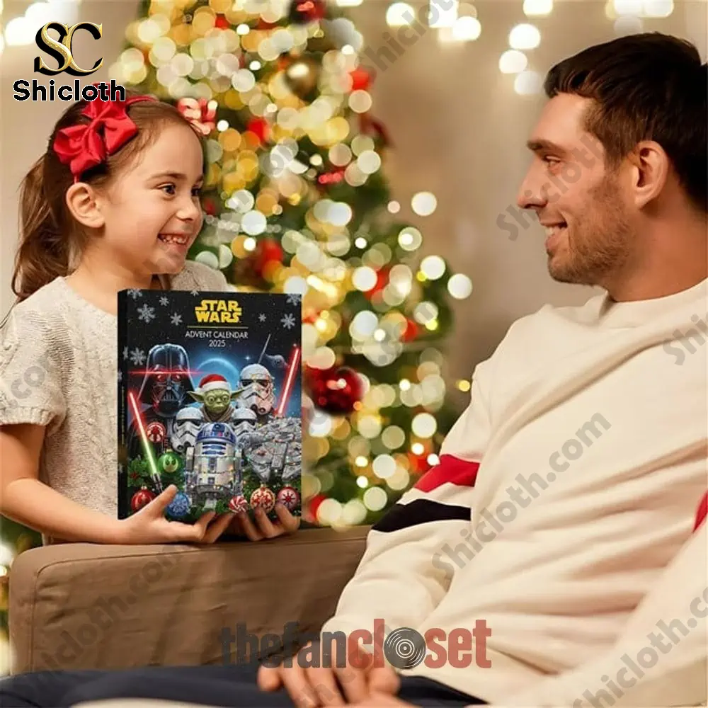 Star Wars Limited Edition Advent Calendar 2025 3 A young girl holding the Star Wars 2025 advent calendar box while smiling at her father near a Christmas tree.