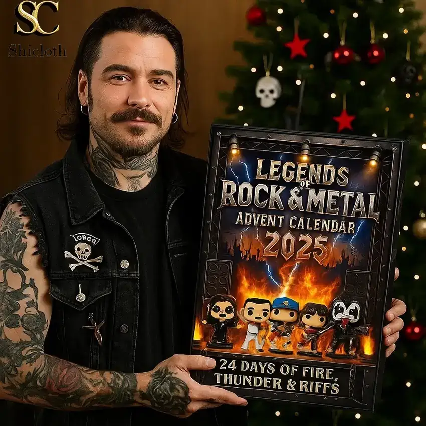 Tattooed man holding a Legends of Rock and Metal advent calendar box in front of a decorated Christmas tree.