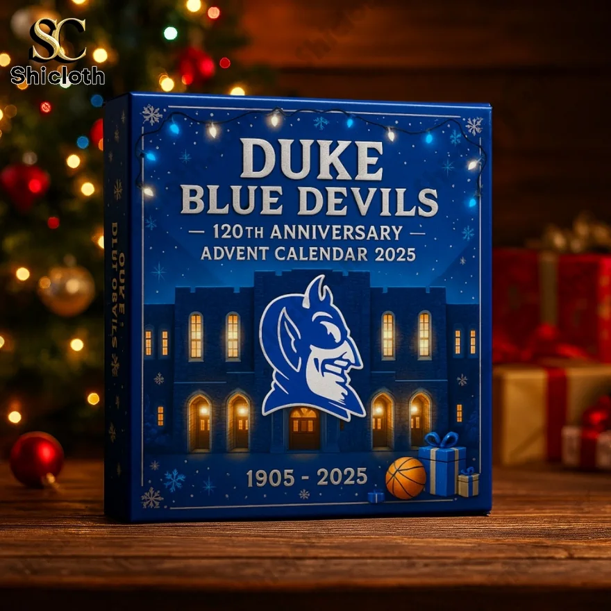 Duke Blue Devils advent calendar box on a wooden table with Christmas tree and lights in background.