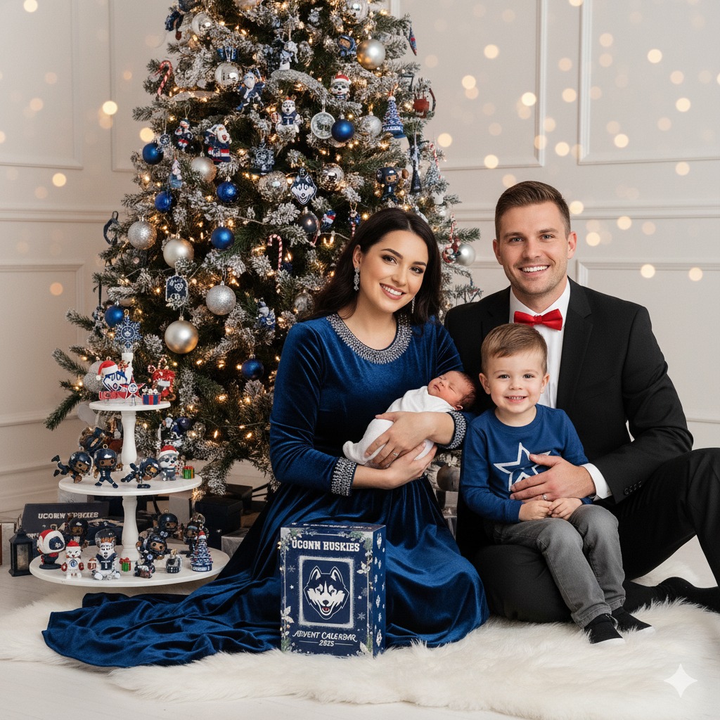 A family poses in front of a Christmas tree decorated with UConn Huskies ornaments and the UConn Huskies Advent Calendar 2025.