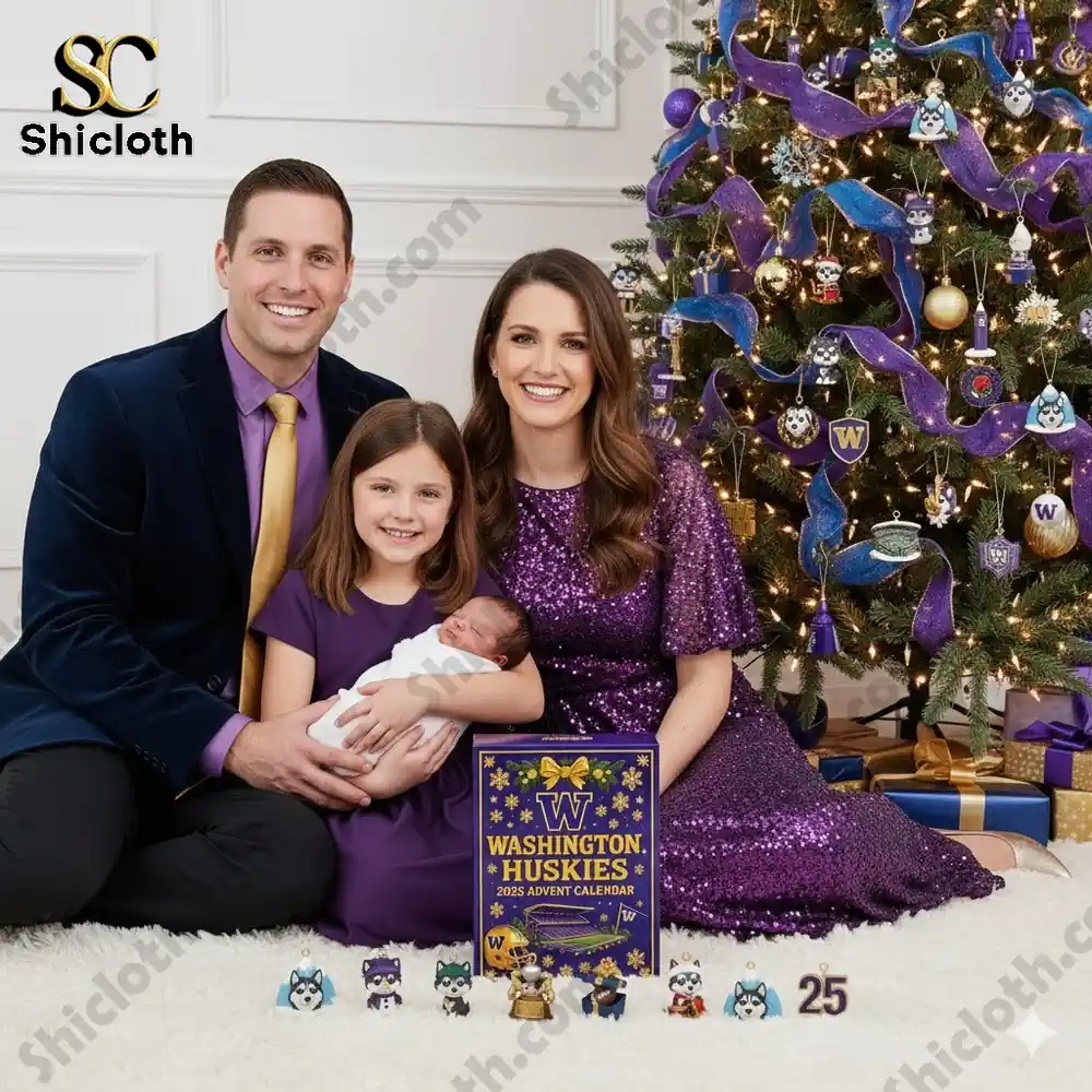 A family sitting by a Christmas tree decorated in purple and gold with the 2025 Washington Huskies Advent Calendar displayed in front of them.