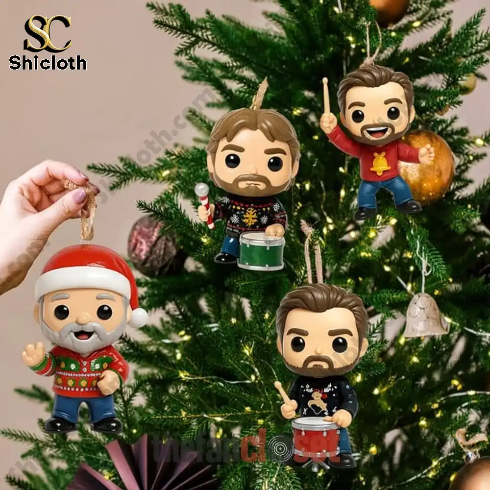 Alabama Rock The Holidays Advent Calendar 2025 3 Hand placing Alabama holiday themed miniature figures as ornaments on a decorated Christmas tree.