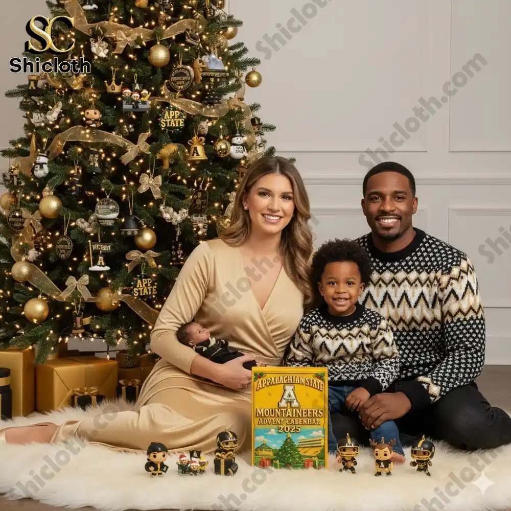 A family sits by a Christmas tree decorated in gold and black with an Appalachian State Mountaineers Advent Calendar 2025 displayed in front of them.