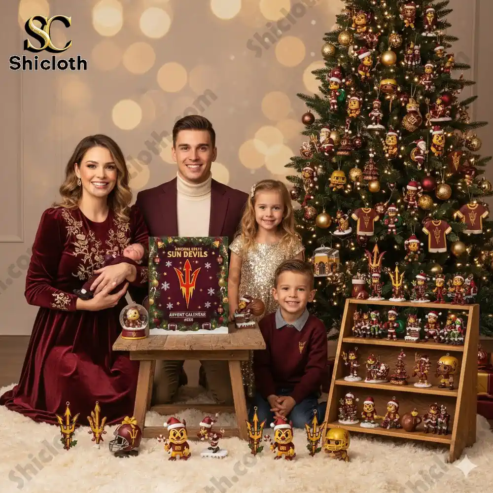 A family sits beside a Christmas tree with the Arizona State Sun Devils Advent Calendar 2025 and themed ornaments!