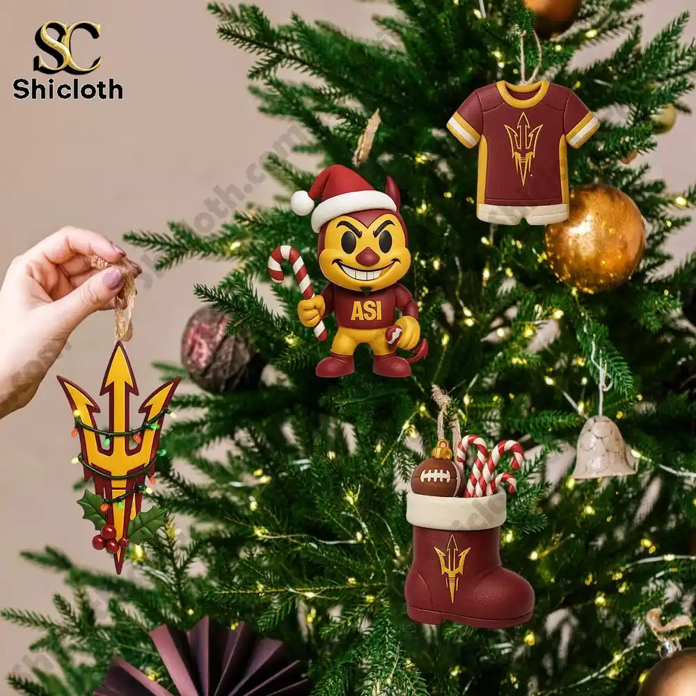 Premium Arizona State Sun Devils Advent Calendar 2025 3 Arizona State Sun Devils themed ornaments hanging on a Christmas tree with lights and gold decorations.