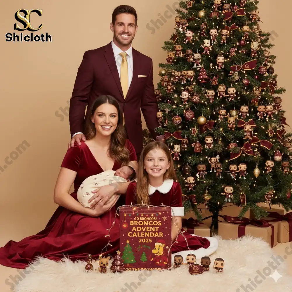 A smiling family with two children posed beside a Christmas tree and the Broncos Advent Calendar 2025 box!