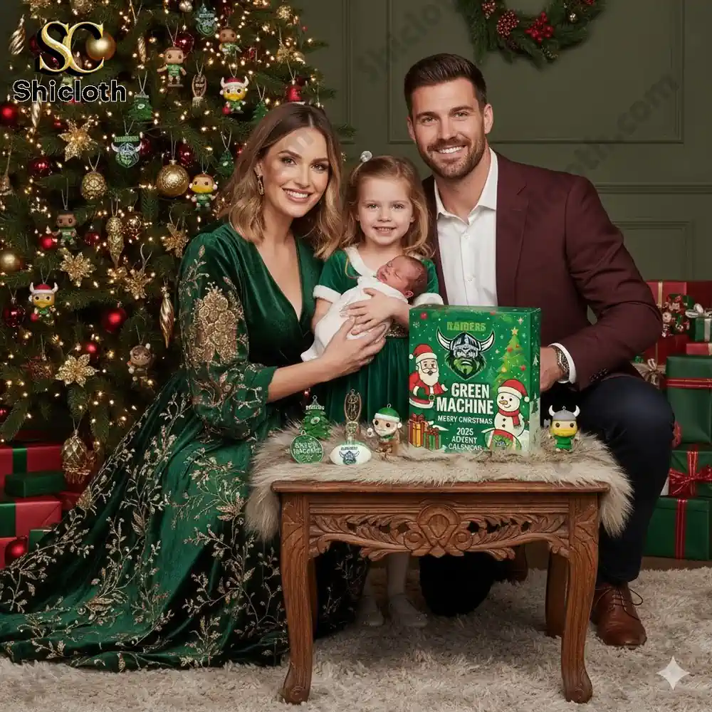 A smiling family sits by a Christmas tree with the Canberra Raiders Green Machine Advent Calendar on a table.