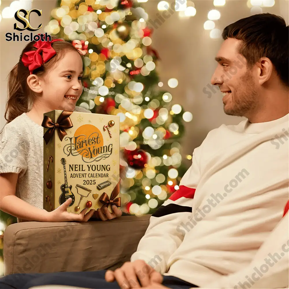 Harvest Young Neil Young Advent Calendar 2025 3 A young girl gives her father a Neil Young Advent Calendar 2025 box by the Christmas tree.