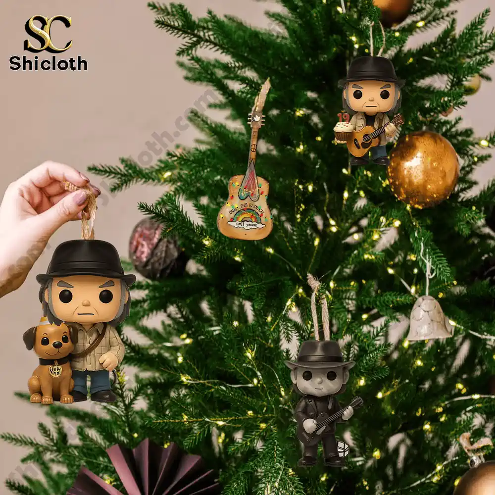 Harvest Young Neil Young Advent Calendar 2025 6 Several Neil Young themed ornaments and guitars hanging on a Christmas tree.