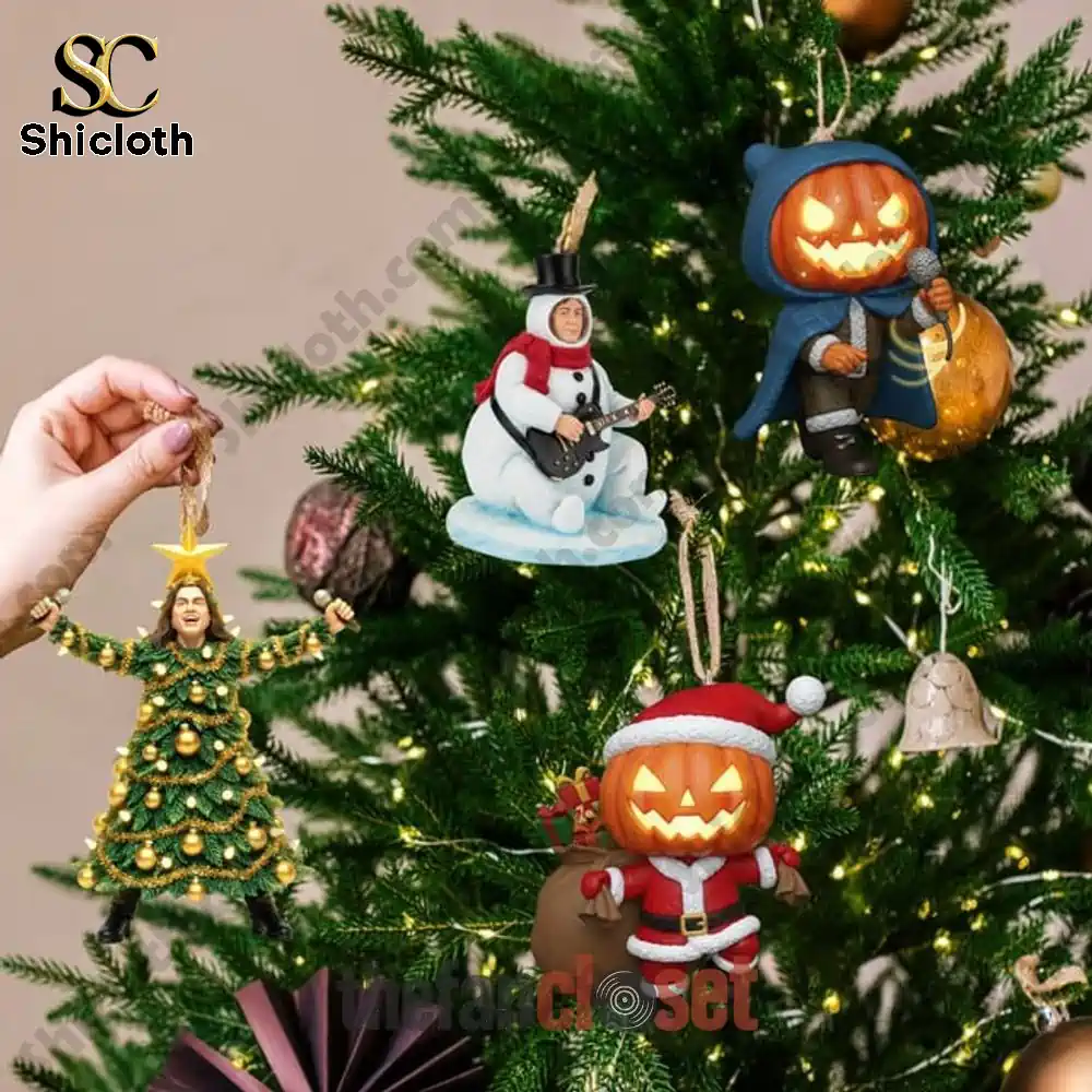 Halloween Pumpkins of Christmas Night Advent Calendar 2025 4 Pumpkin and band themed ornaments hanging on Christmas tree branches.