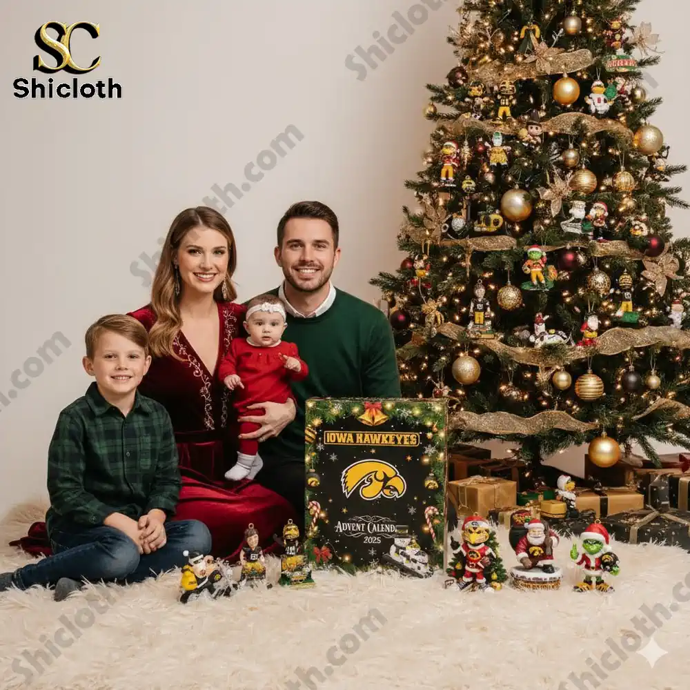 Family sitting by Christmas tree with Iowa Hawkeyes 2025 Advent Calendar.