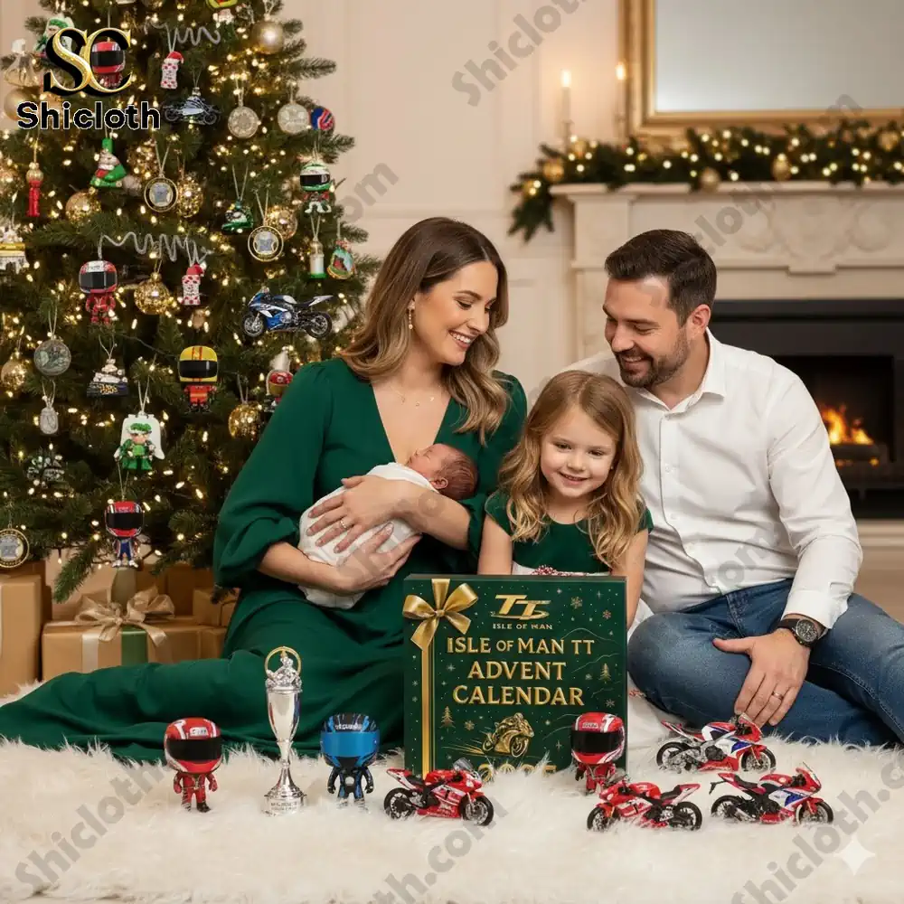 A family sitting by a Christmas tree with the Isle of Man TT Advent Calendar 2025 and miniature motorcycles.
