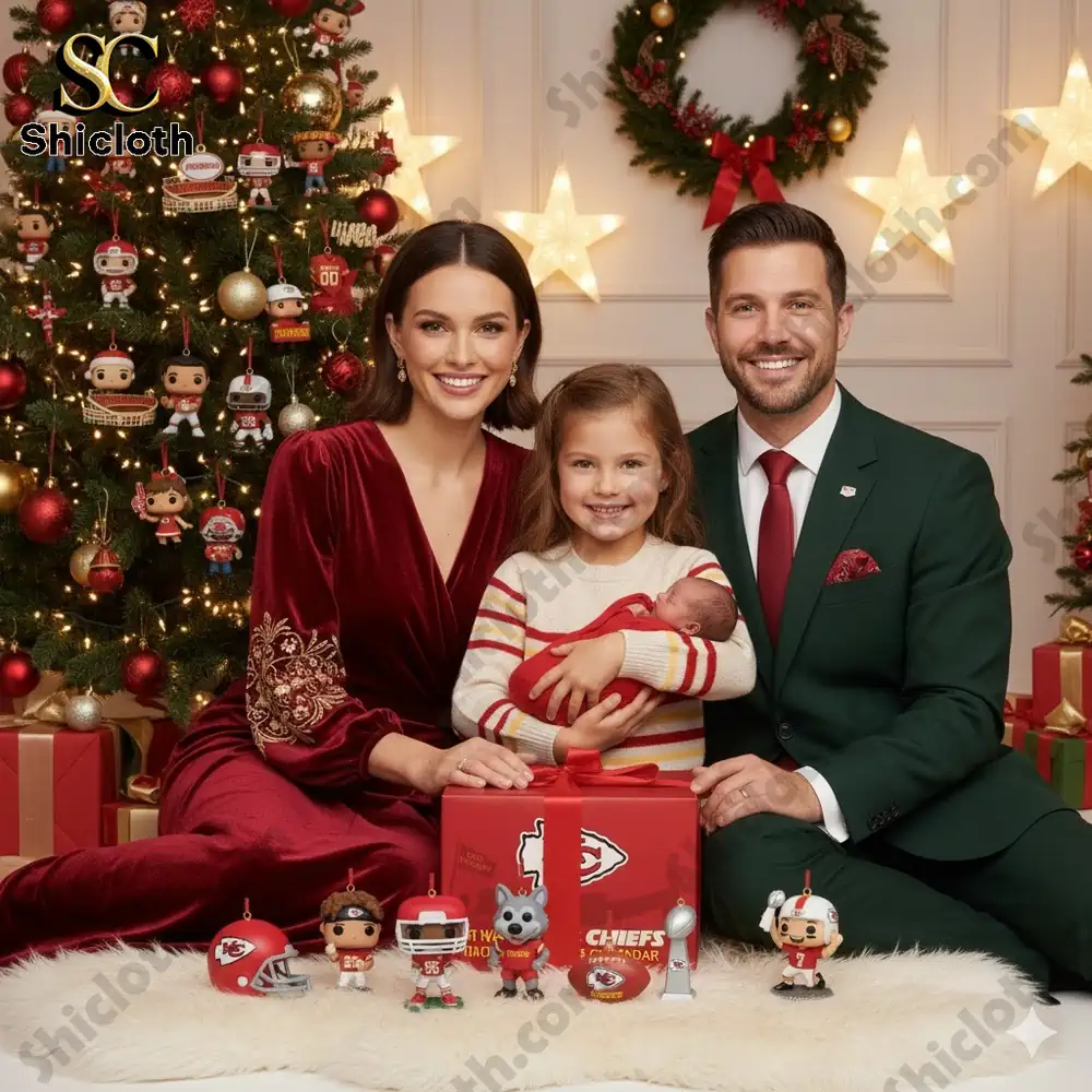 A family sits beside a Christmas tree with Kansas City Chiefs decorations and a Kansas City Chiefs Advent Calendar box in front of them!
