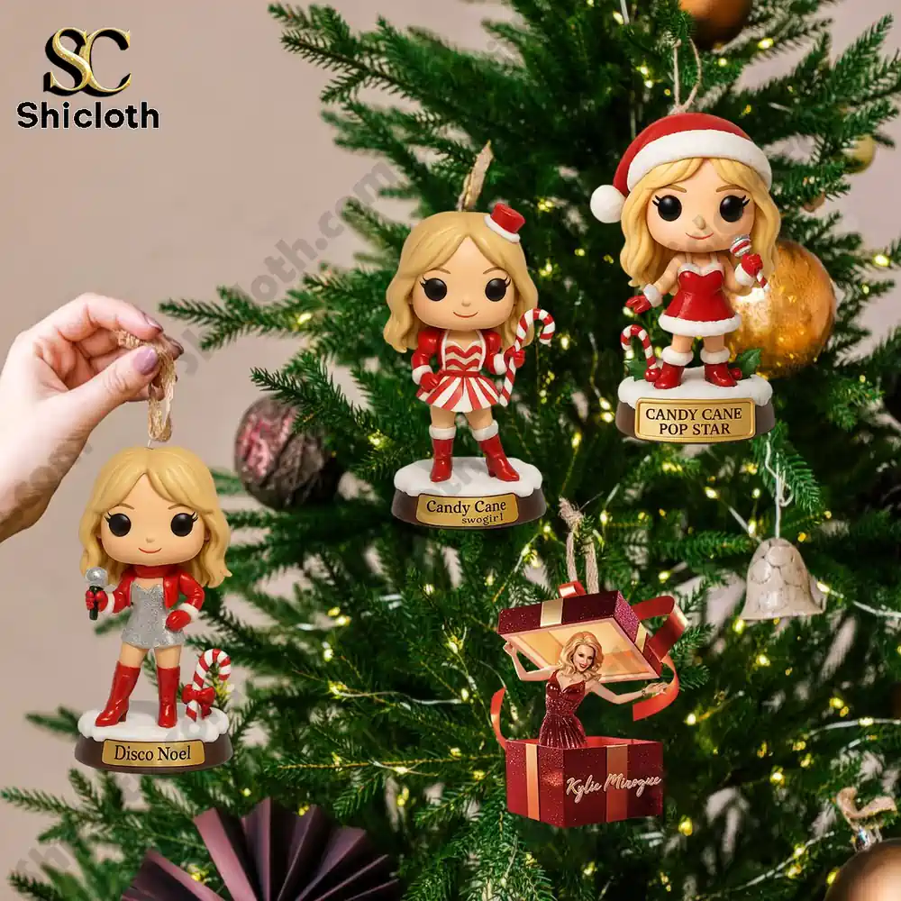 Kylie Minogue Premium Advent Calendar 2025 6 Three Kylie Minogue inspired holiday figurine ornaments including Disco Noel and Candy Cane designs hanging on a Christmas tree.