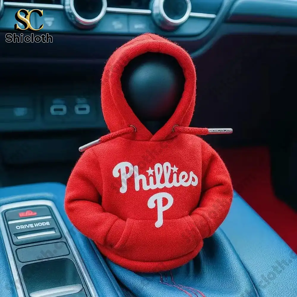 Red hoodie with Philadelphia Phillies logo covering a car gear shift knob!