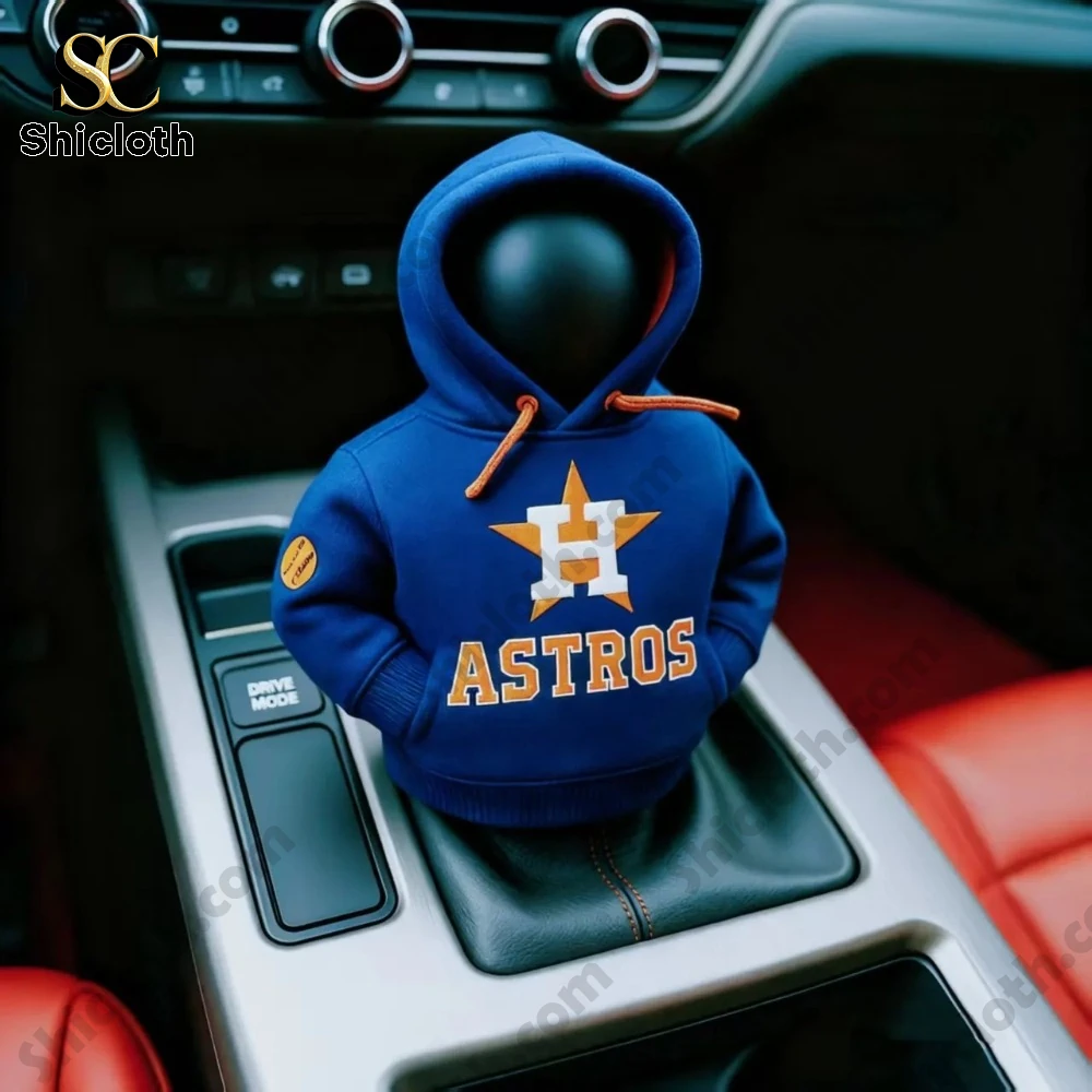 A car gear shift cover figure wearing a blue hoodie with the Astros baseball team logo inside a vehicle by Shicloth!