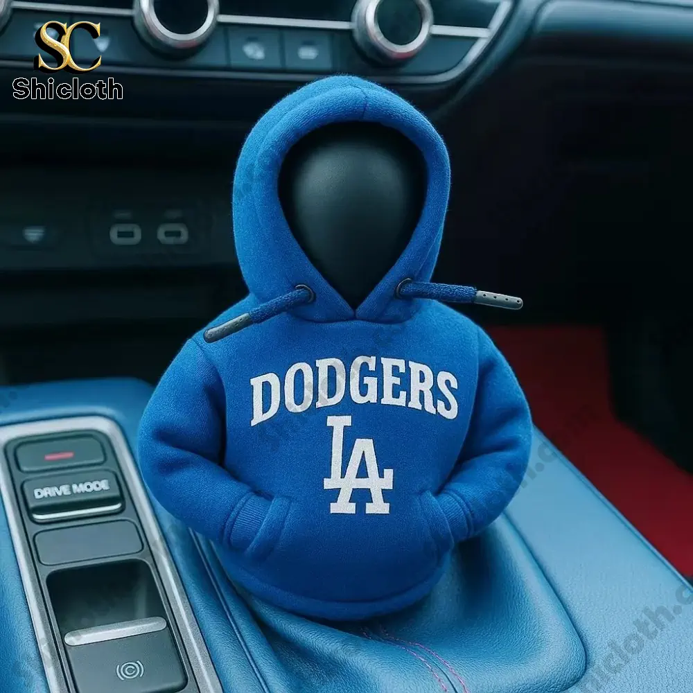 A blue Los Angeles Dodgers hoodie cover on a car gear shift knob inside a vehicle!
