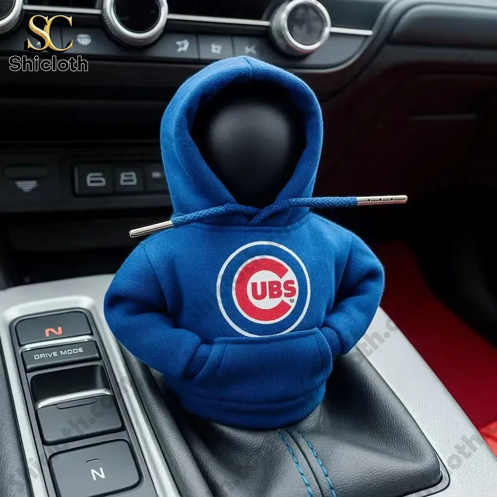 A car gear shift knob dressed in a blue Cubs hoodie inside a car interior!