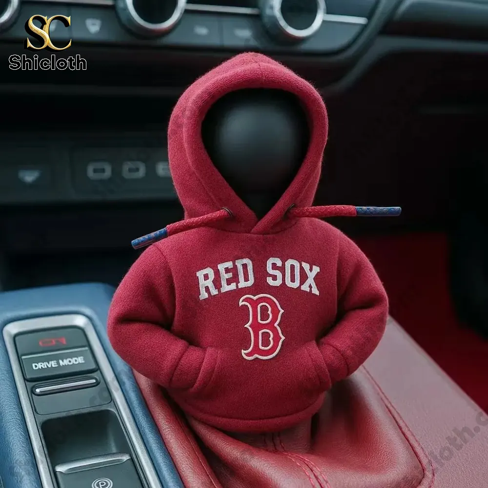 A car gear shift knob dressed in a red Red Sox hoodie inside a car interior!