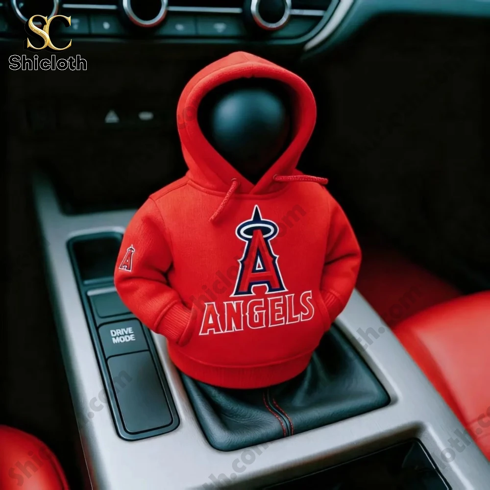 A red Los Angeles Angels hoodie cover on a car gear shift knob inside a vehicle interior!