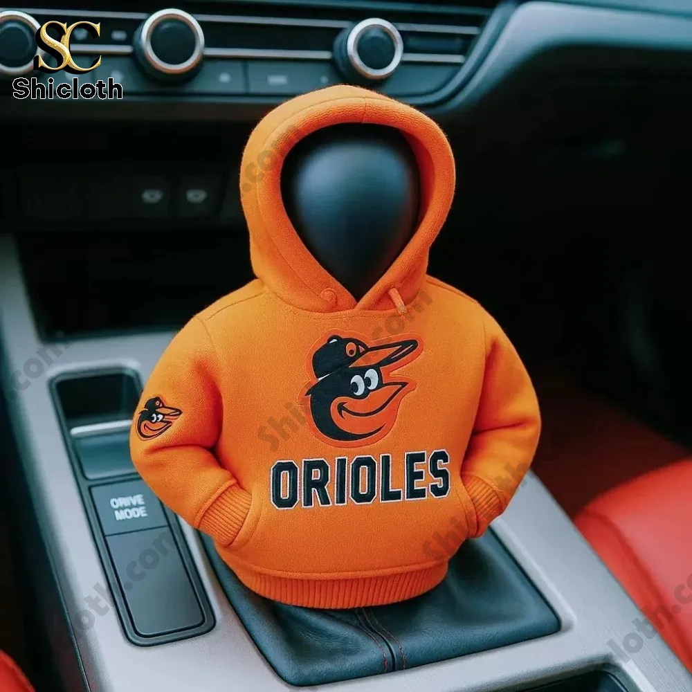 A car gear shift knob dressed in an orange Orioles hoodie inside a car interior!