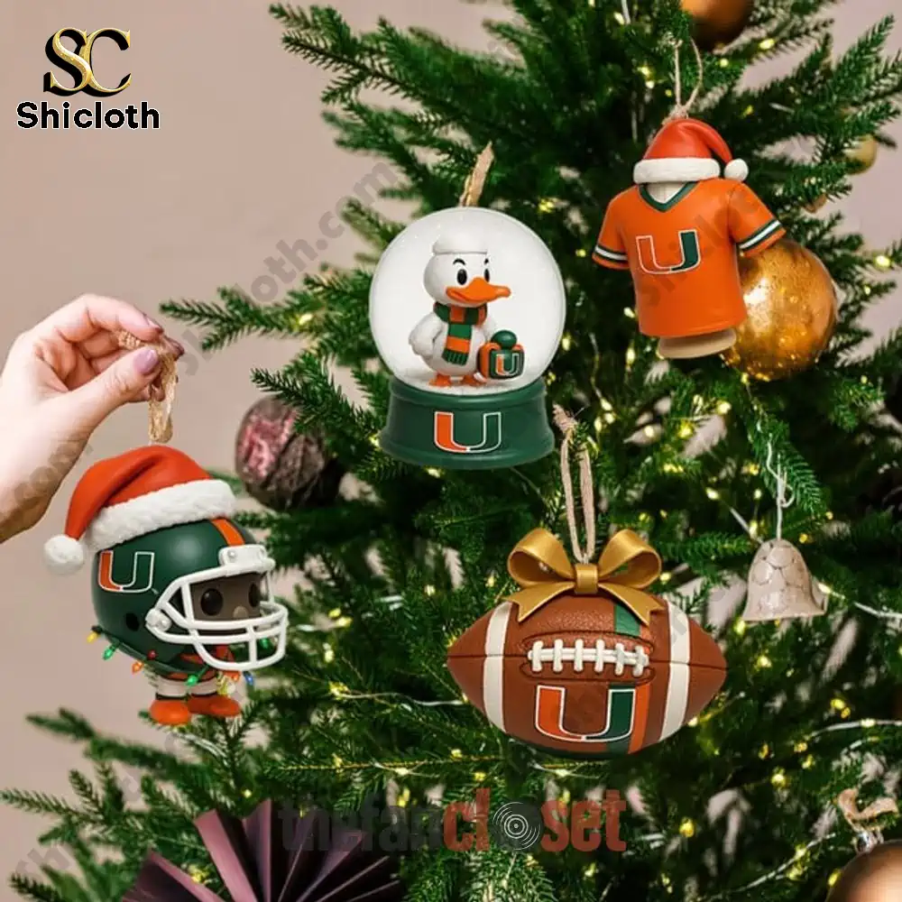 Miami Hurricanes Christmas 2025 Advent Calendar 4 Hand hanging Miami Hurricanes themed ornaments on Christmas tree.