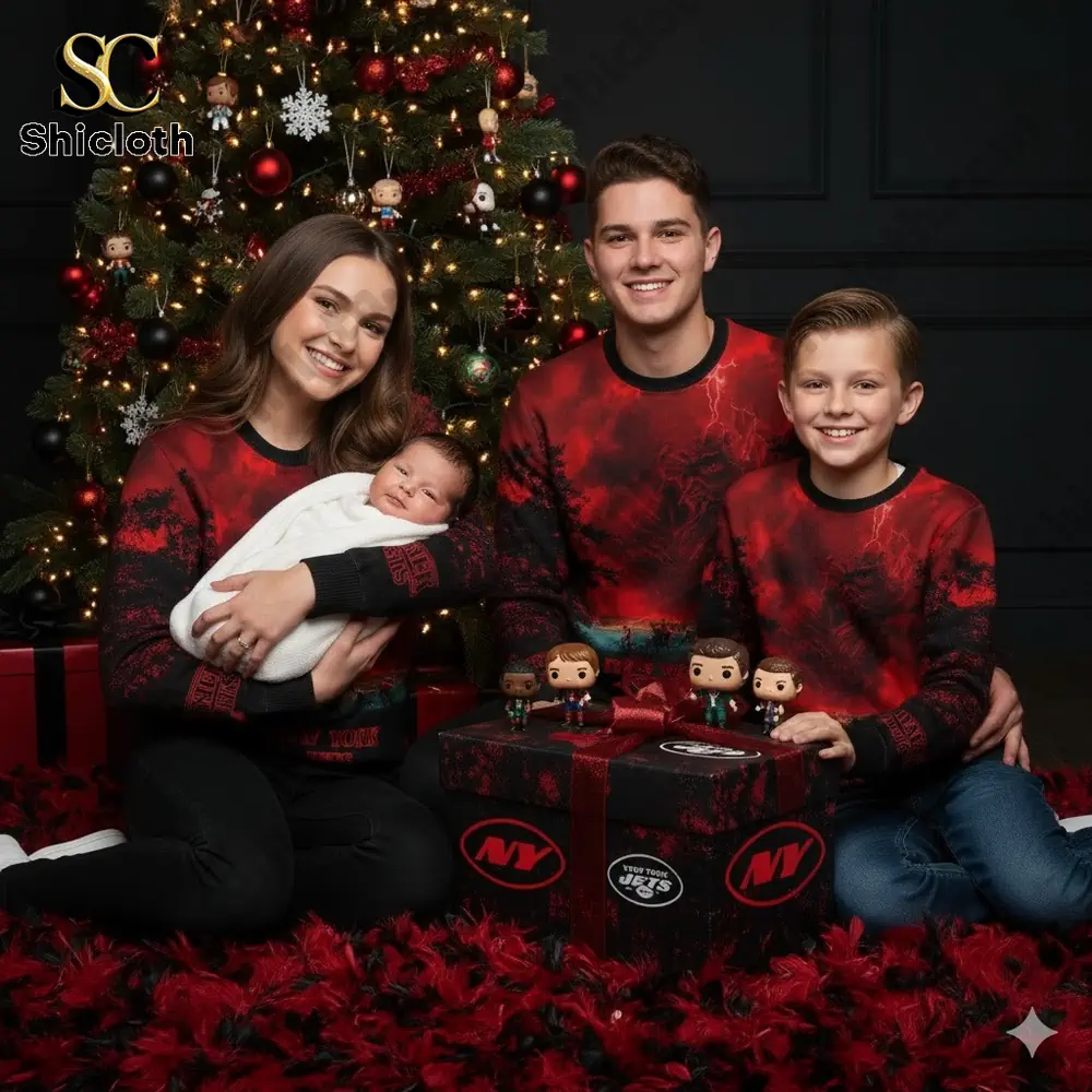 Family wearing matching New York Jets Christmas sweaters posing by a Christmas tree!