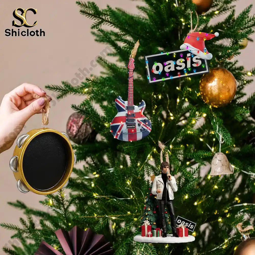 Oasis Band Premium Advent Calendar 2025 6 Oasis themed ornaments including guitar and figures hanging on Christmas tree.