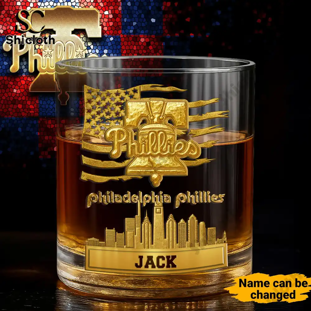 Philadelphia Phillies whiskey glass with golden logo and city skyline design.