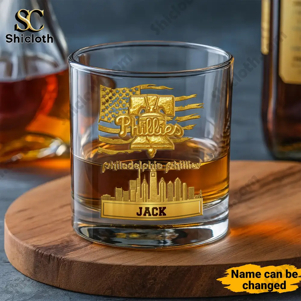 Philadelphia Phillies whiskey glass with golden Liberty Bell and skyline design.