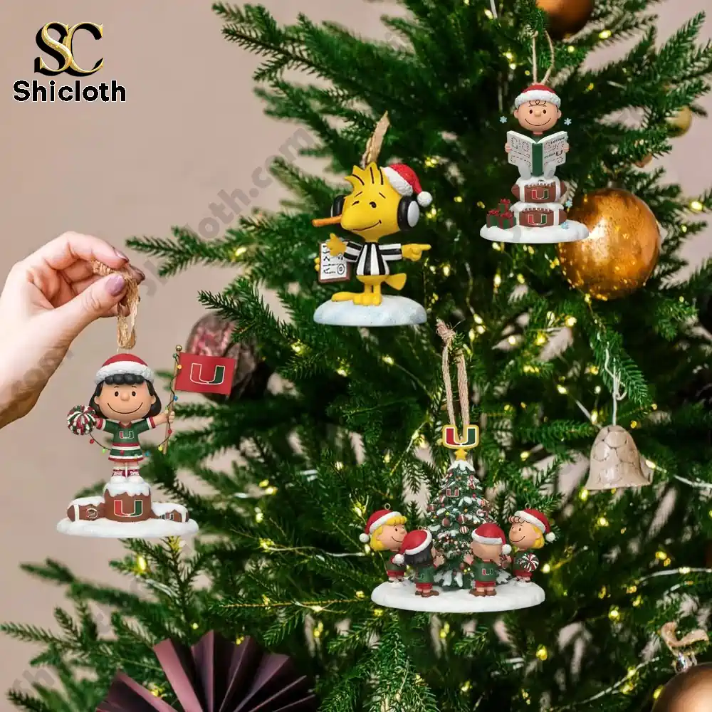 Close up of Peanuts ornaments with Miami Hurricanes designs hanging on a Christmas tree!