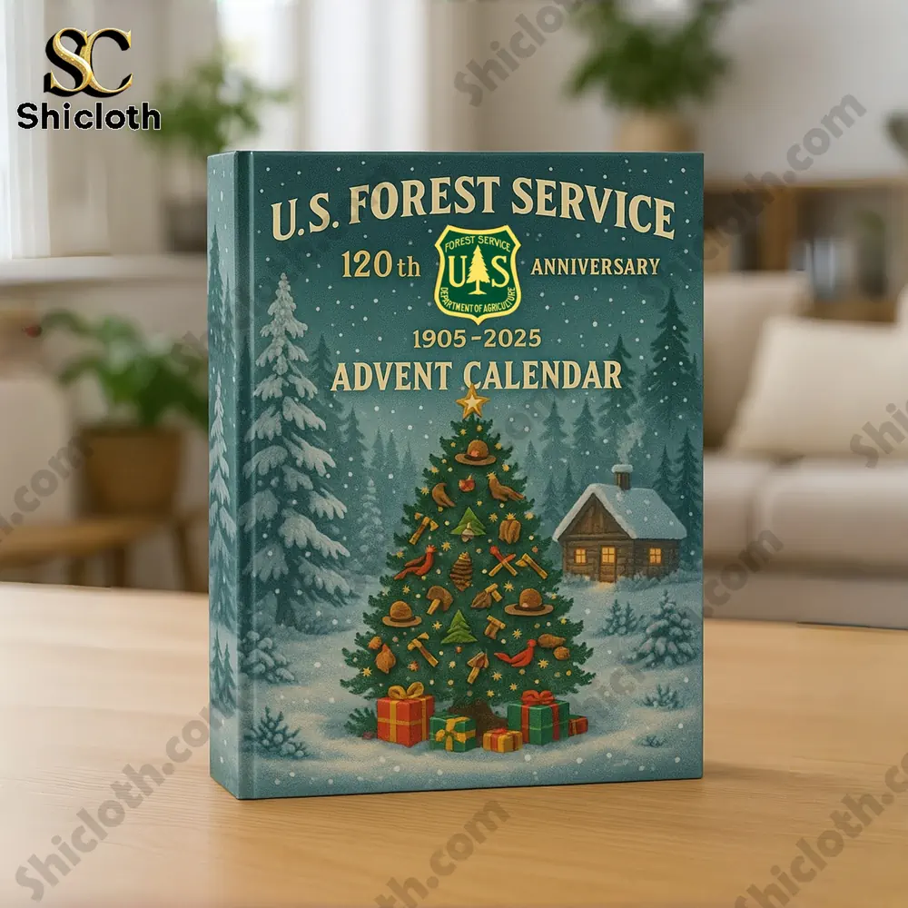 A close up of the U.S. Forest Service 120th Anniversary Advent Calendar box with a Christmas tree design on a wooden table!