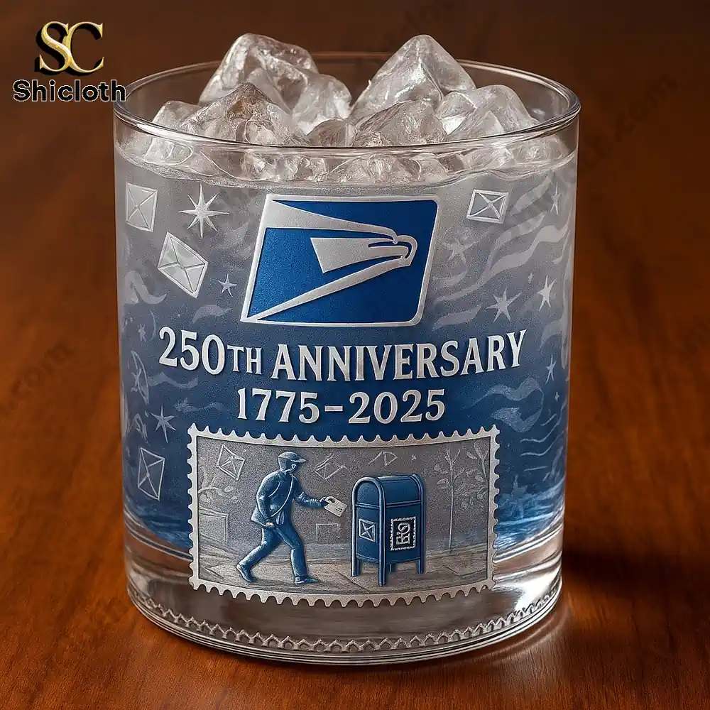 USPS 250th Anniversary whiskey glass with ice and engraved blue design.