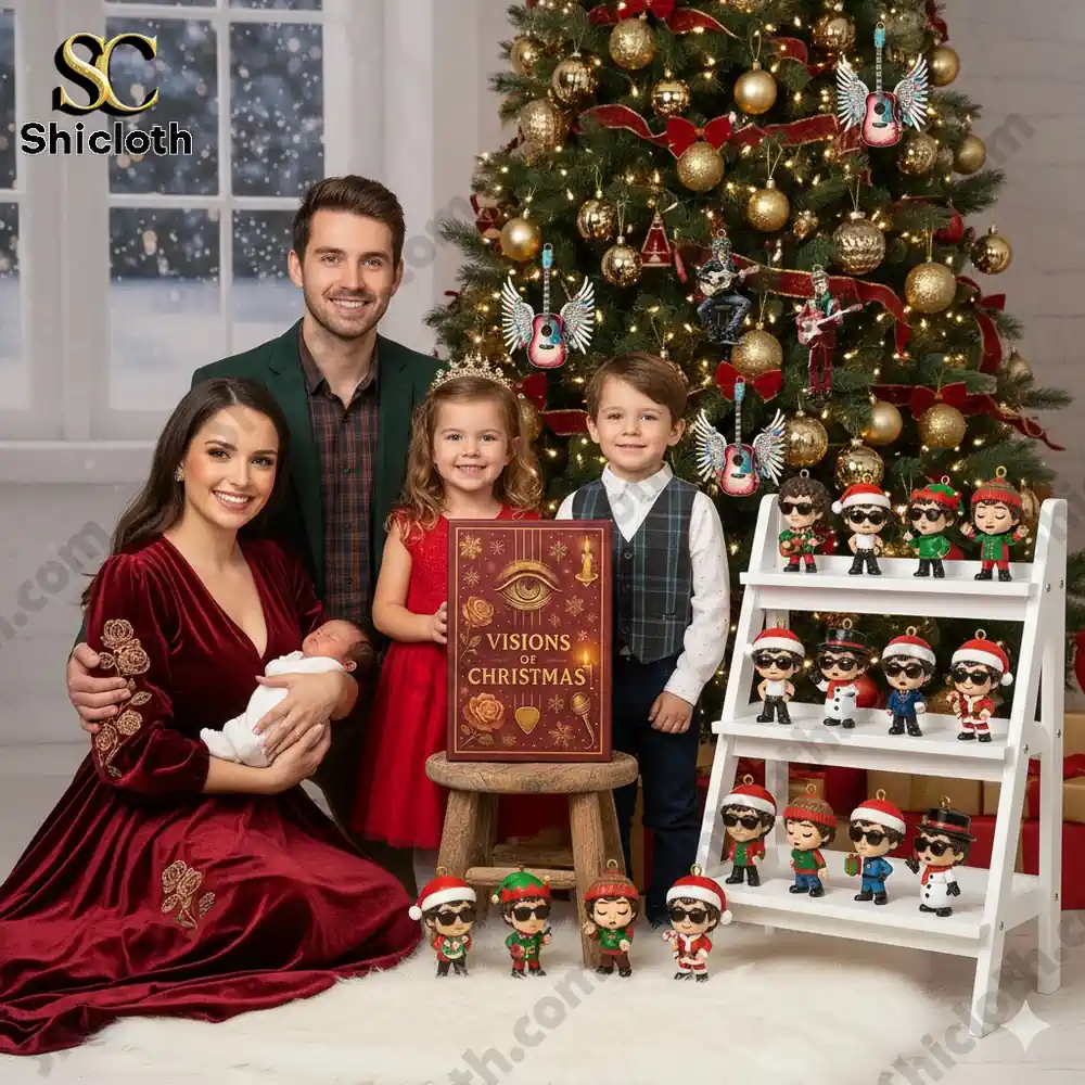 A smiling family poses by a Christmas tree with a Visions of Christmas box and festive collectible ornaments.