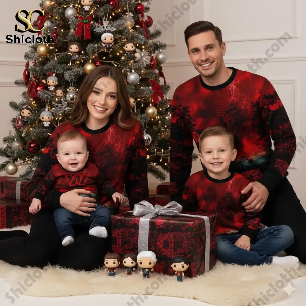 A family sits near a Christmas tree wearing matching Washington Commanders Stranger Things sweaters.