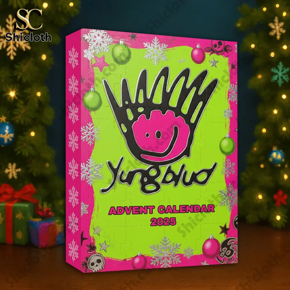 Hot Sale 2025 Yungblud Advent Calendar 2025 3 The Yungblud Advent Calendar 2025 box placed on a table near a Christmas tree with lights.