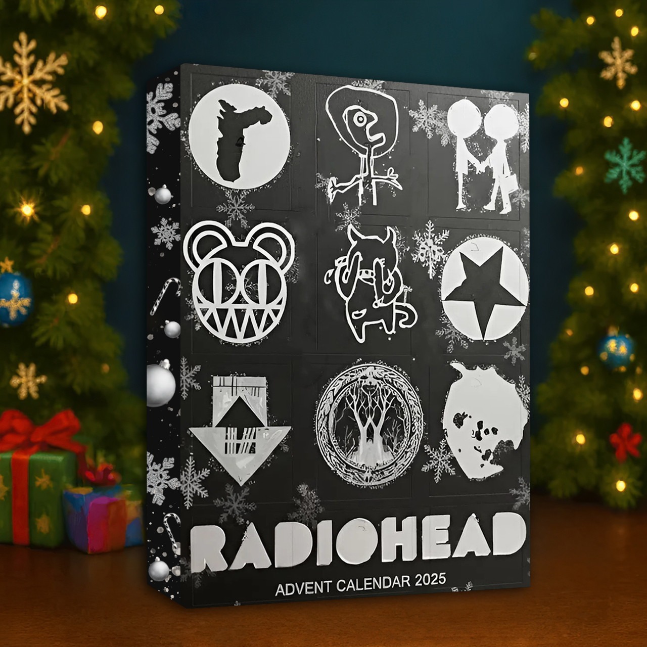 Radiohead Premium Advent Calendar 2025 3 A Radiohead Advent Calendar 2025 box displayed on a holiday table beside a decorated Christmas tree.