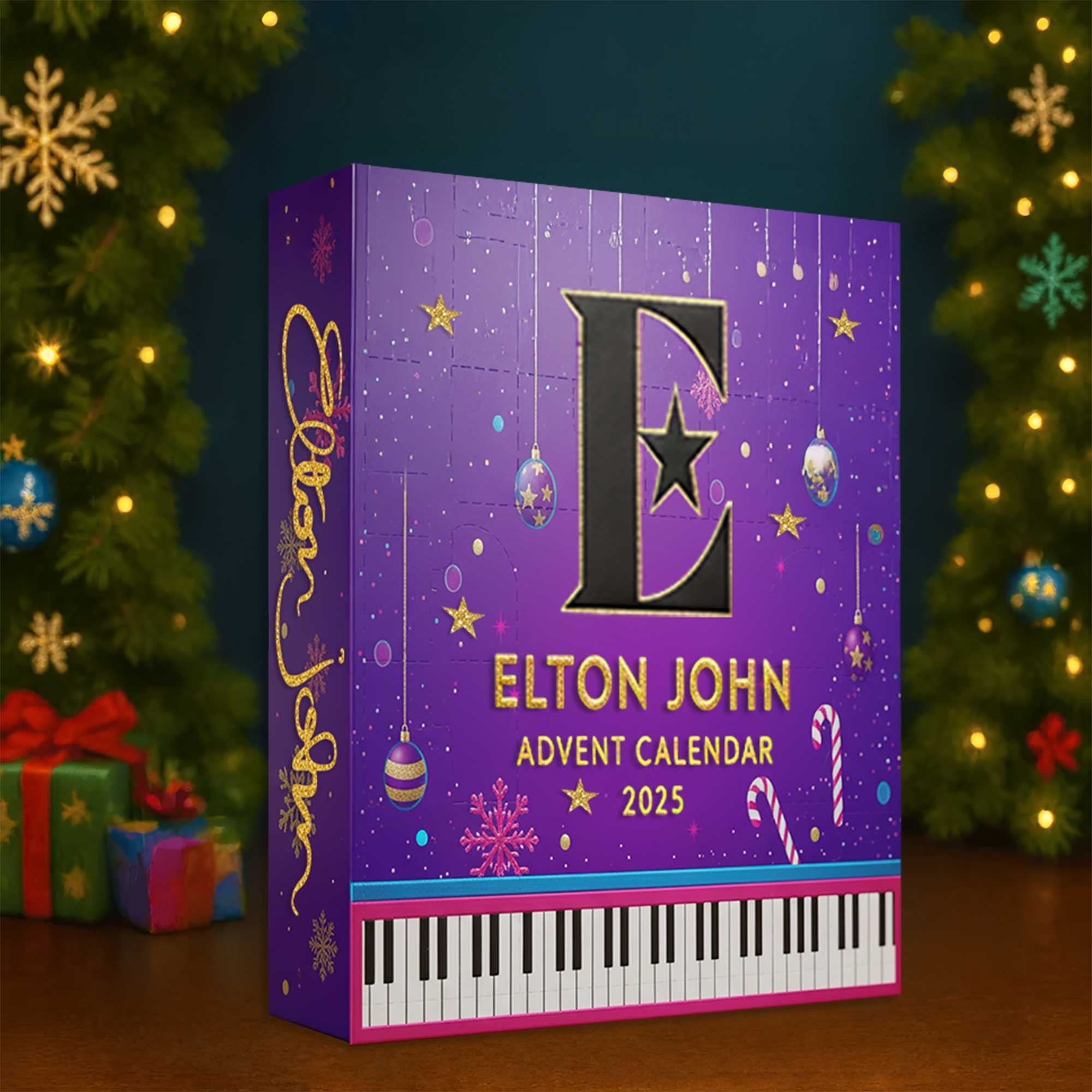 Elton John Advent Calendar 2025 3 Elton John Advent Calendar 2025 box placed on a table near a Christmas tree with lights and presents.