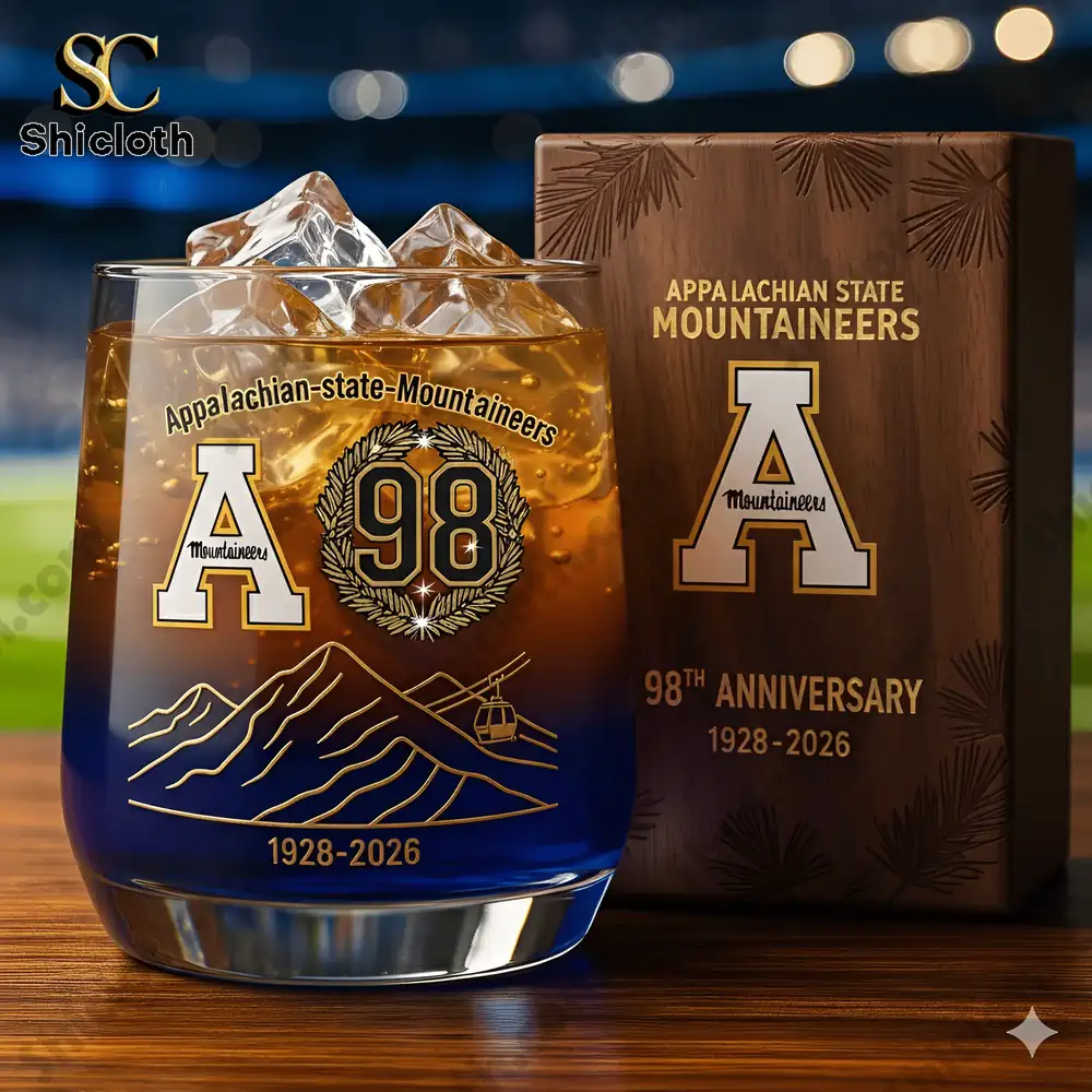 A commemorative glass featuring Appalachian State Mountaineers 98th anniversary logo with ice cubes and a wooden box packaging.