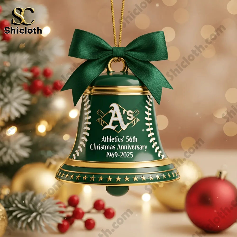 Close up of a green Athletics Christmas bell ornament with gold accents and anniversary text 1969-2025!