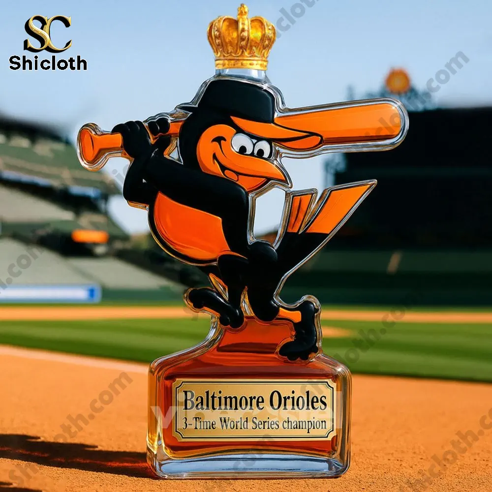 A Baltimore Orioles whiskey bottle with a crown cap at a baseball stadium.