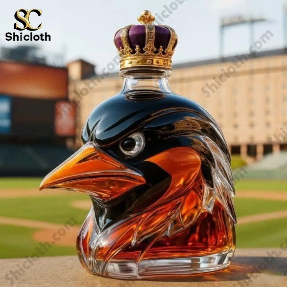 A detailed whiskey bottle shaped like a bird with a royal crown on top, placed in a baseball stadium setting.