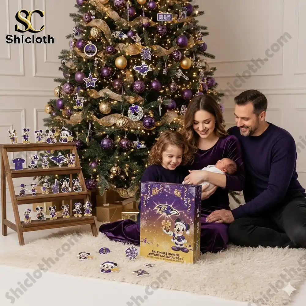 A family opens a Baltimore Ravens themed Mickey Mouse Advent calendar beside a purple and gold Christmas tree!